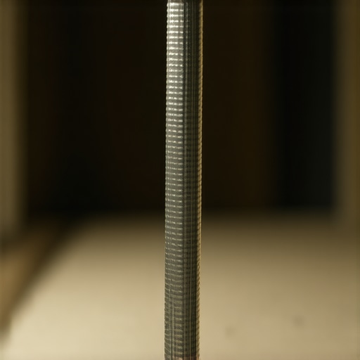Close-up of a dishwasher drain hose properly installed with a high loop under the sink to prevent siphoning.